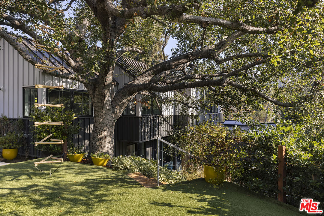 461 West Rustic Road Santa Monica, CA 90402 - Photo 31 of 31 a view of swimming pool with lawn chairs and plants