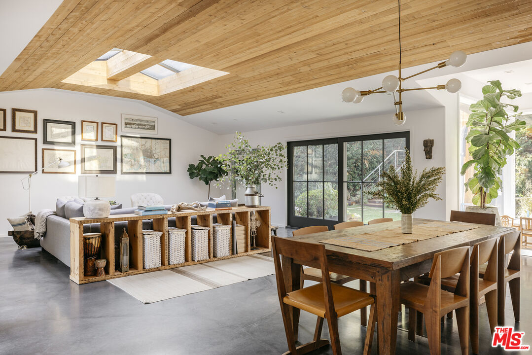 461 West Rustic Road Santa Monica, CA 90402 - Photo 4 of 31 a view of a dining room with furniture window and outside view