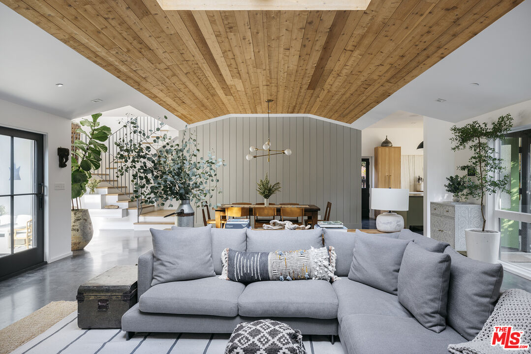 461 West Rustic Road Santa Monica, CA 90402 - Photo 6 of 31 a living room with furniture and a chandelier