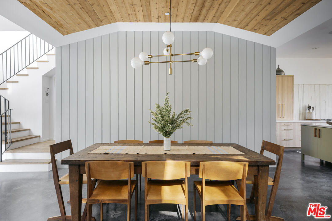 461 West Rustic Road Santa Monica, CA 90402 - Photo 7 of 31 a dining room with furniture and wooden floor