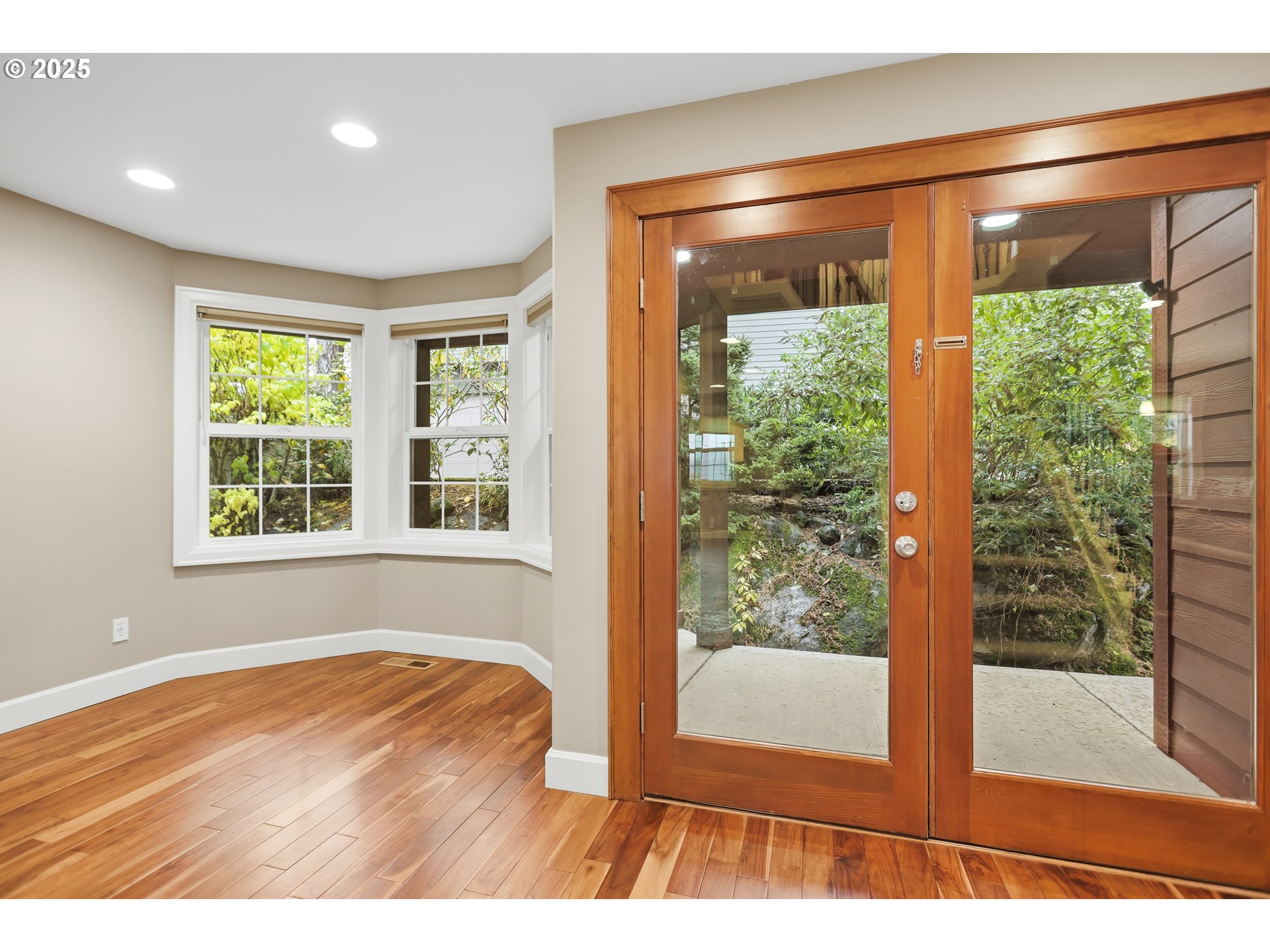 602 Frankton Road Hood River, OR 97031 - Photo 20 of 47 a view of an empty room with wooden floor and a window