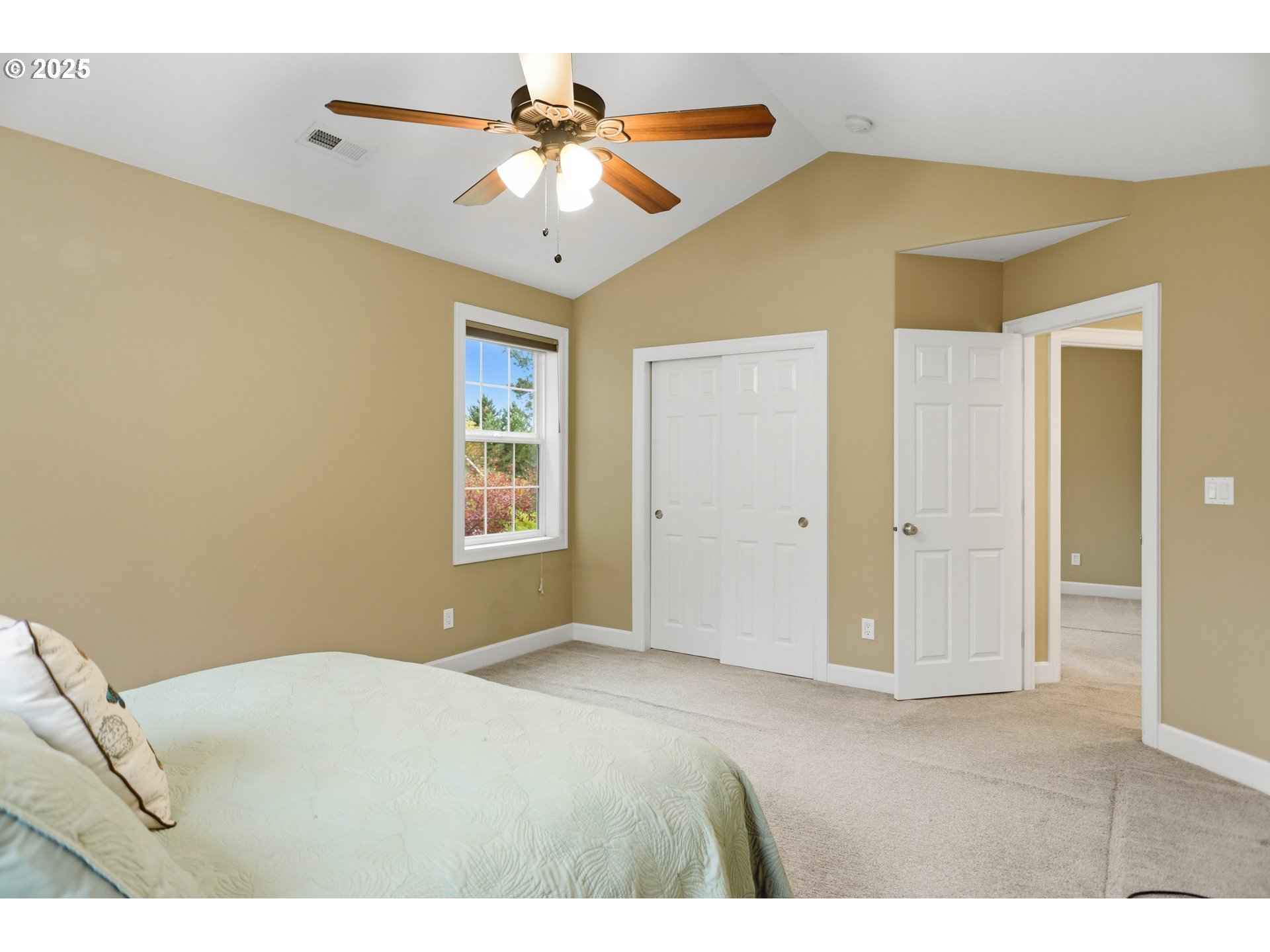 602 Frankton Road Hood River, OR 97031 - Photo 33 of 47 a bedroom with a bed and a chandelier