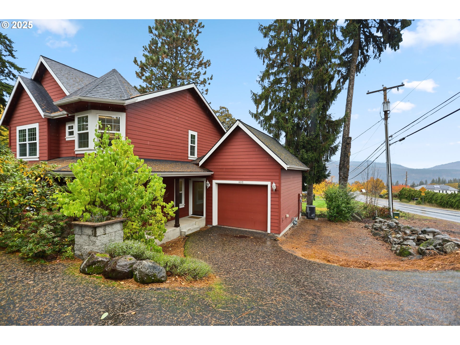602 Frankton Road Hood River, OR 97031 - Photo 46 of 47 a aerial view of a house with a yard and potted plants