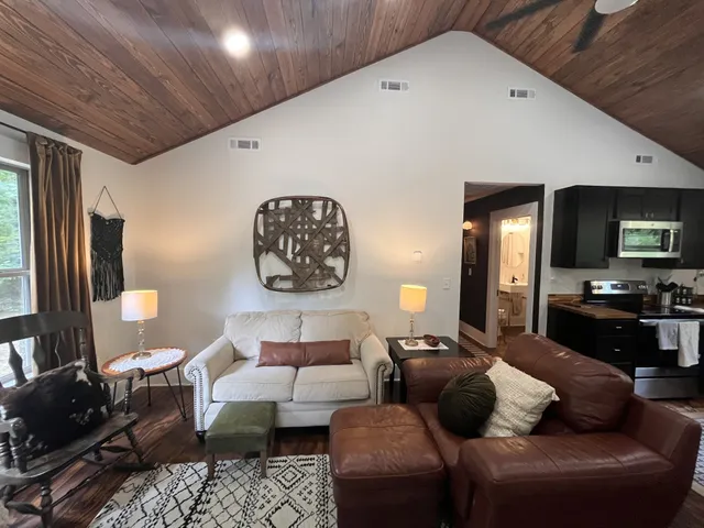 a kitchen with a refrigerator and a stove