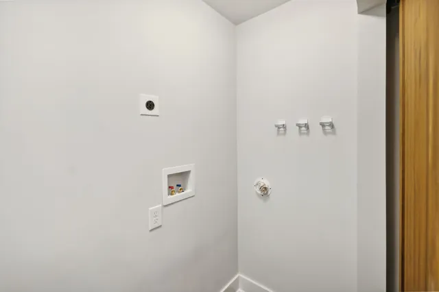 a living room with furniture gym equipment and a large window