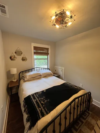a bedroom with a bed and cabinets