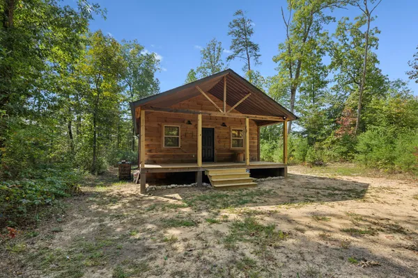 a view of a room with wooden floor and outdoor space