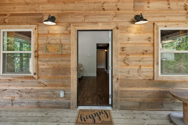 a kitchen with stainless steel appliances granite countertop a refrigerator a sink dishwasher a stove and a microwave oven