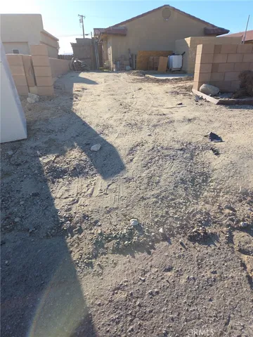 a view of wooden fence near a building