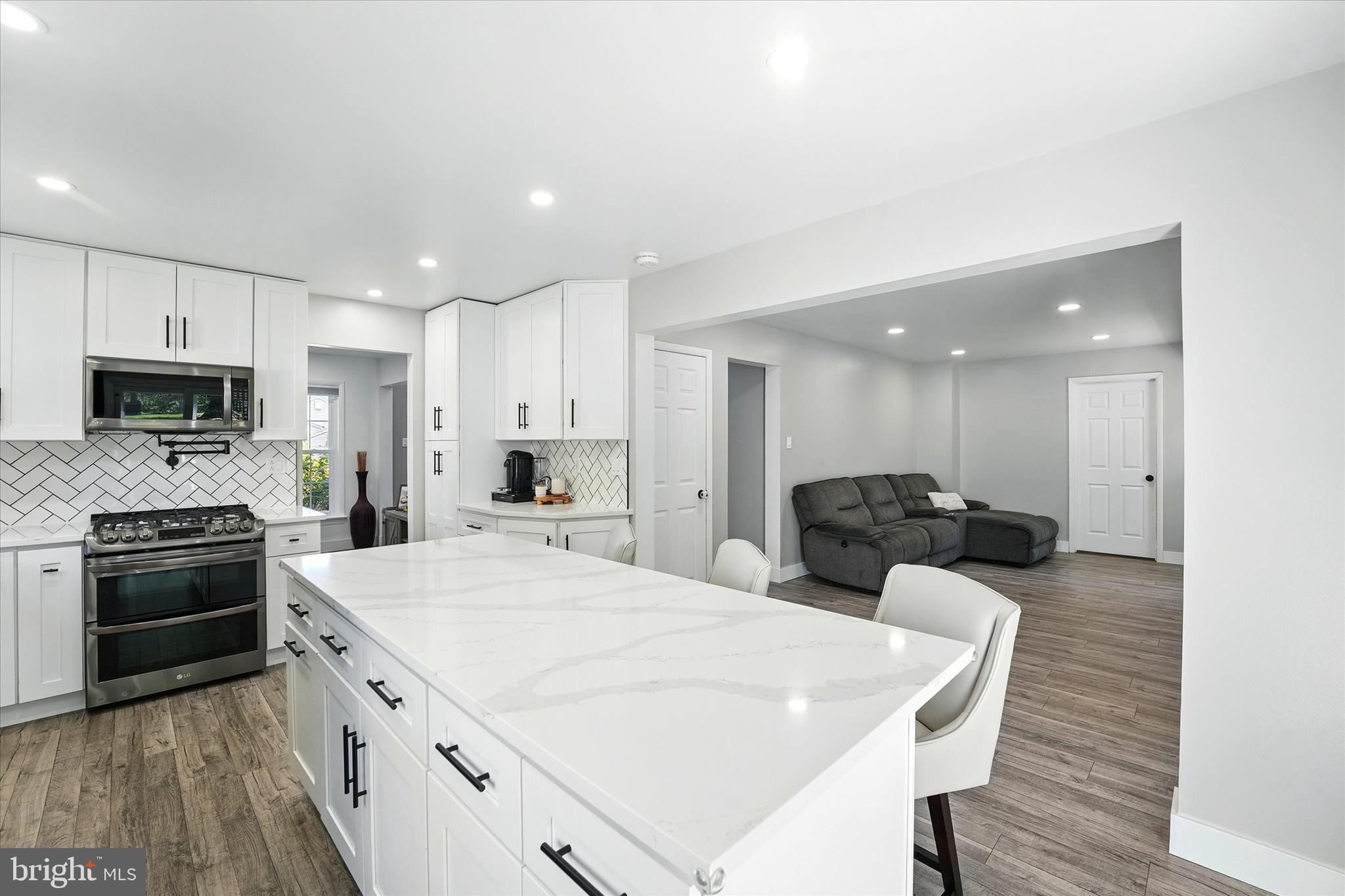 237 Bridge Road Upper Chichester, PA 19061 - Photo 8 of 27 a large kitchen with a table and chairs
