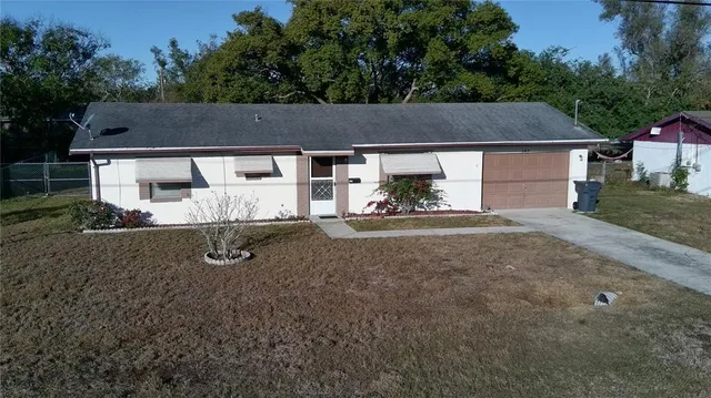 front view of a house with a yard