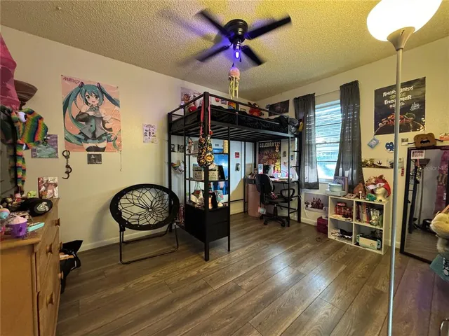 a view of a dining room with furniture wooden floor and a chandelier