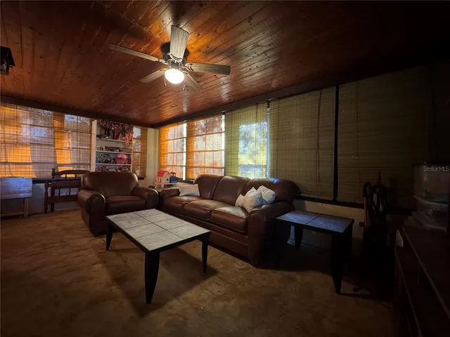 a living room with furniture a chandelier