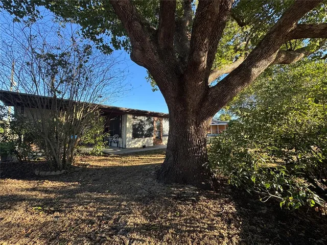 a backyard of a house with lots of green space