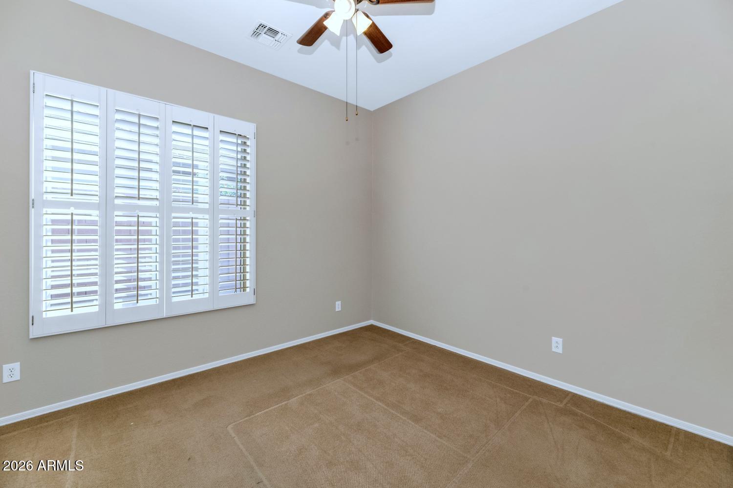 41123 North River Bend Road Phoenix, AZ 85086 - Photo 22 of 45 a view of an empty room with a window