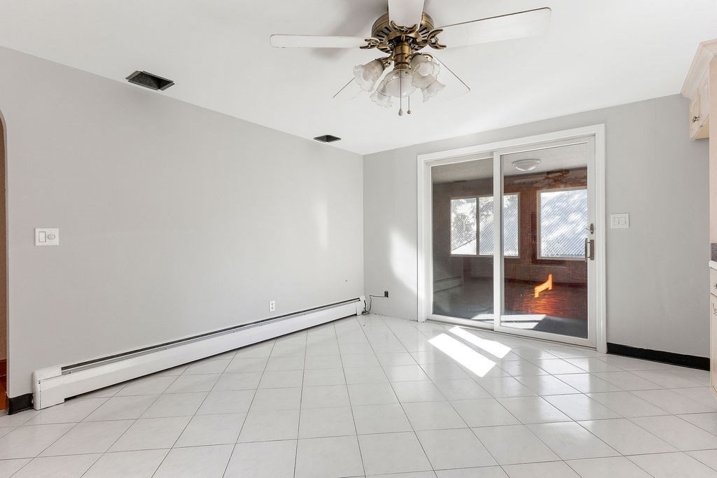 32 Duncan Road Everett, MA 02149 - Photo 14 of 30 an empty room with fan and windows