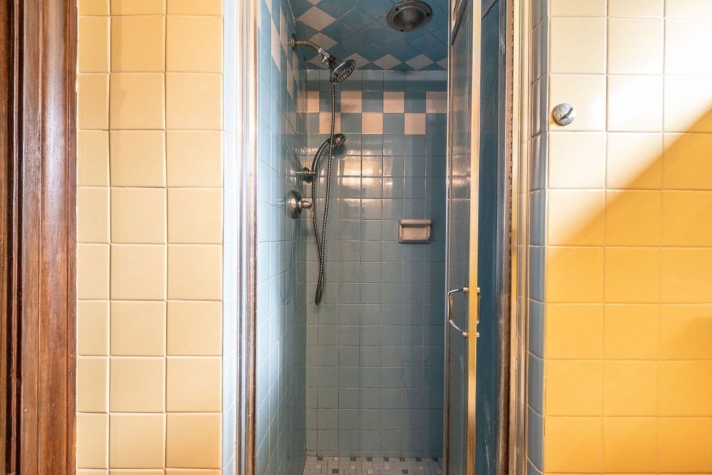 32 Duncan Road Everett, MA 02149 - Photo 24 of 30 a bathroom with a glass shower door