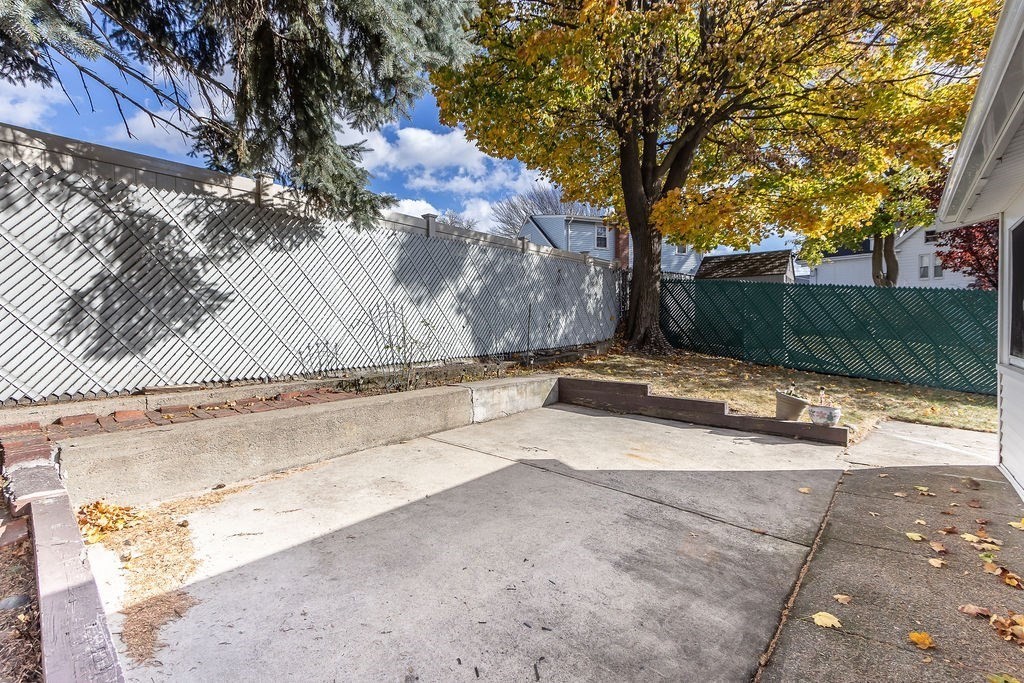 32 Duncan Road Everett, MA 02149 - Photo 27 of 30 a view of a yard with a tree