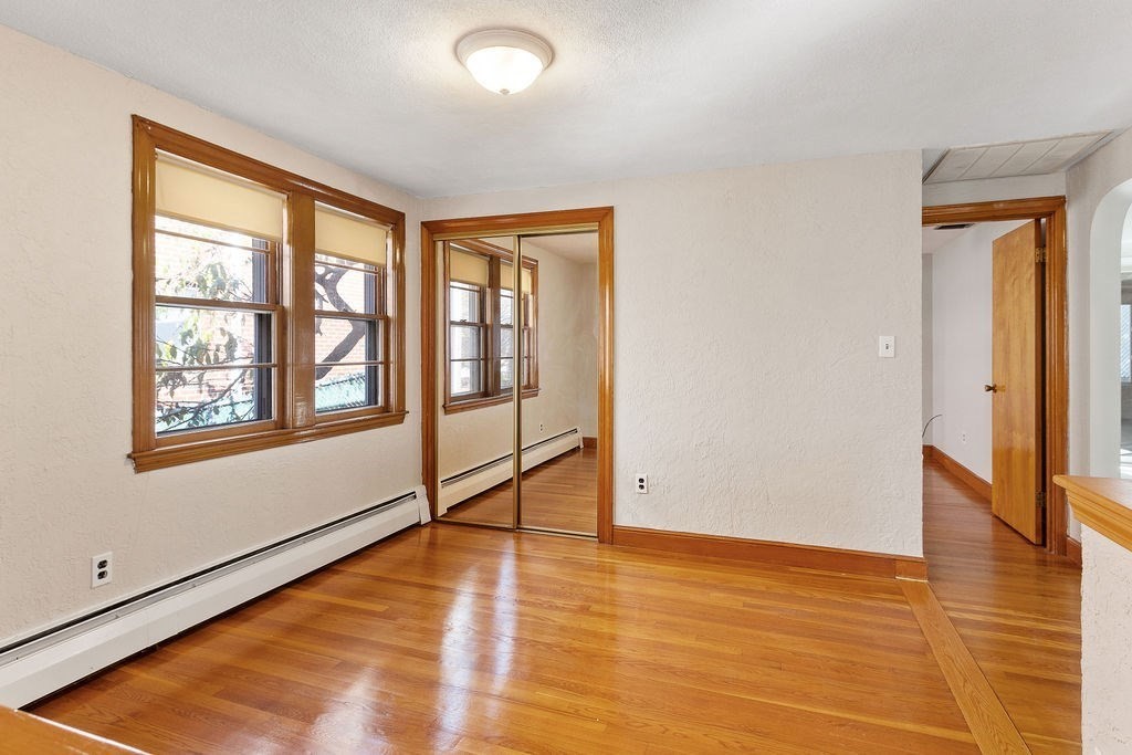 32 Duncan Road Everett, MA 02149 - Photo 6 of 30 a view of an empty room with window and wooden floor