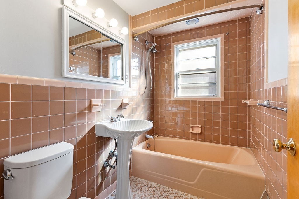 32 Duncan Road Everett, MA 02149 - Photo 9 of 30 a bathroom with a sink a toilet and shower