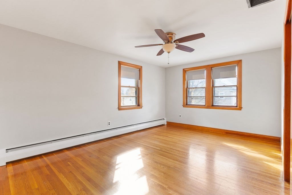 32 Duncan Road Everett, MA 02149 - Photo 10 of 30 a view of an empty room with window and wooden floor