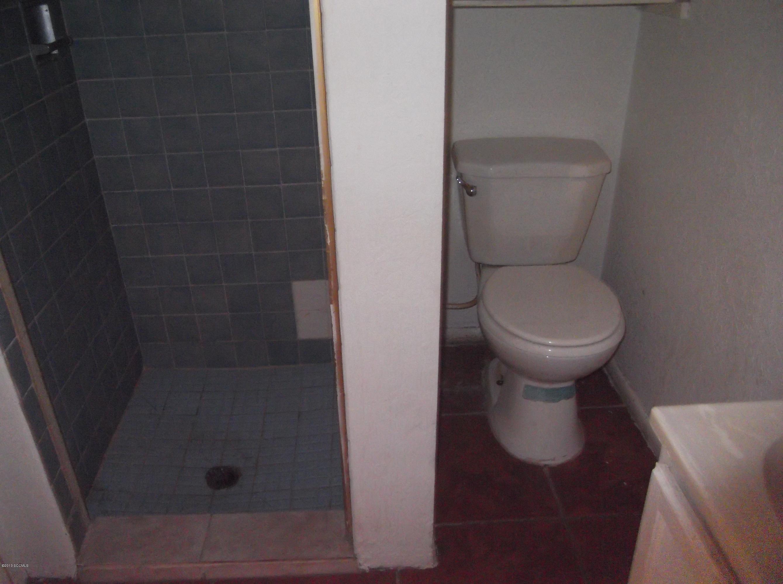 1241 Bellota Court Rio Rico, AZ 85648 - Photo 8 of 12 a bathroom with a toilet and a shower