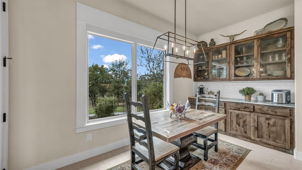 1320 Post Oak Road Gordon, TX 76453 - Photo 22 of 40 Dining space with baseboards and a chandelier