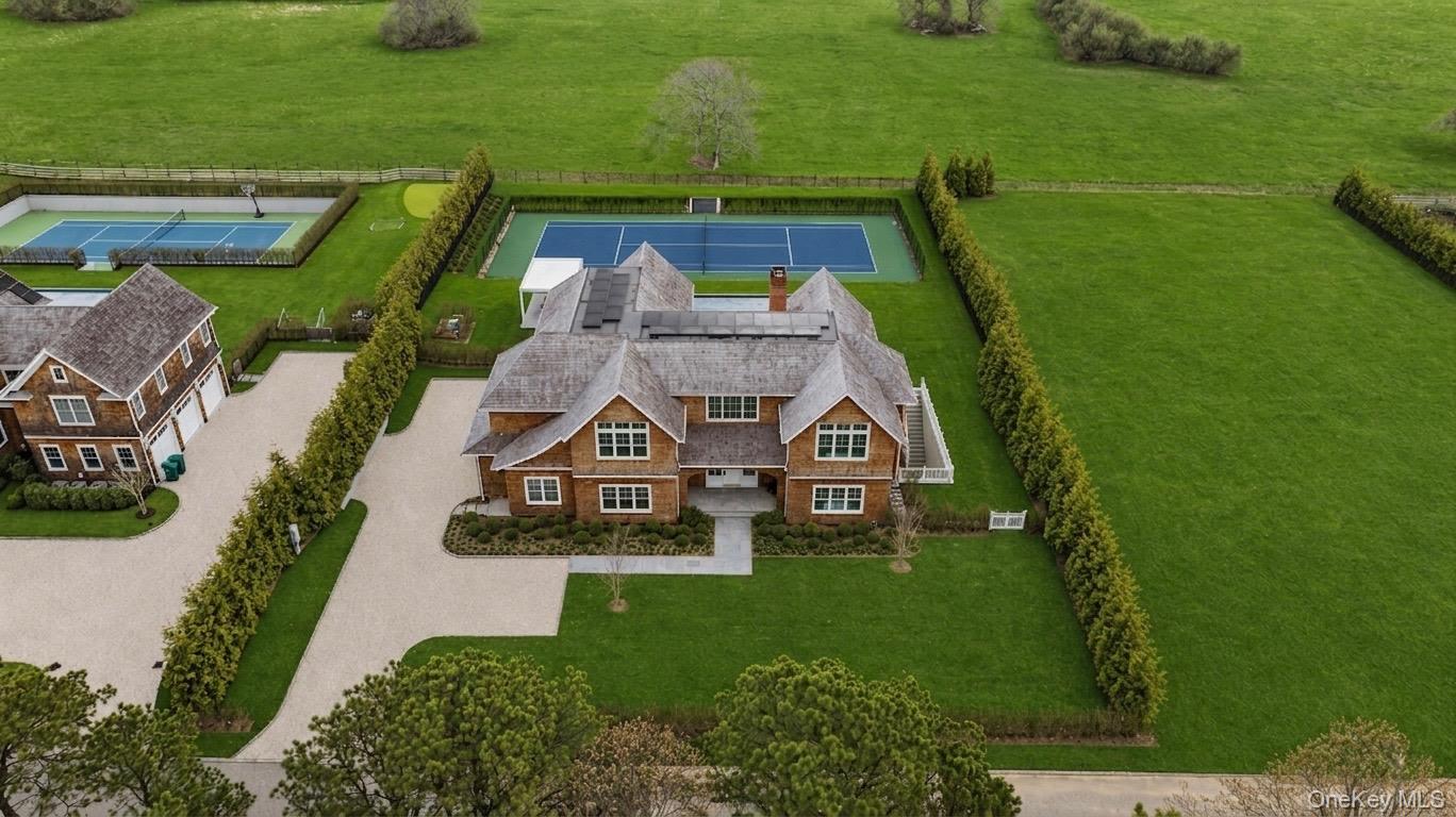 an aerial view of a house with a garden