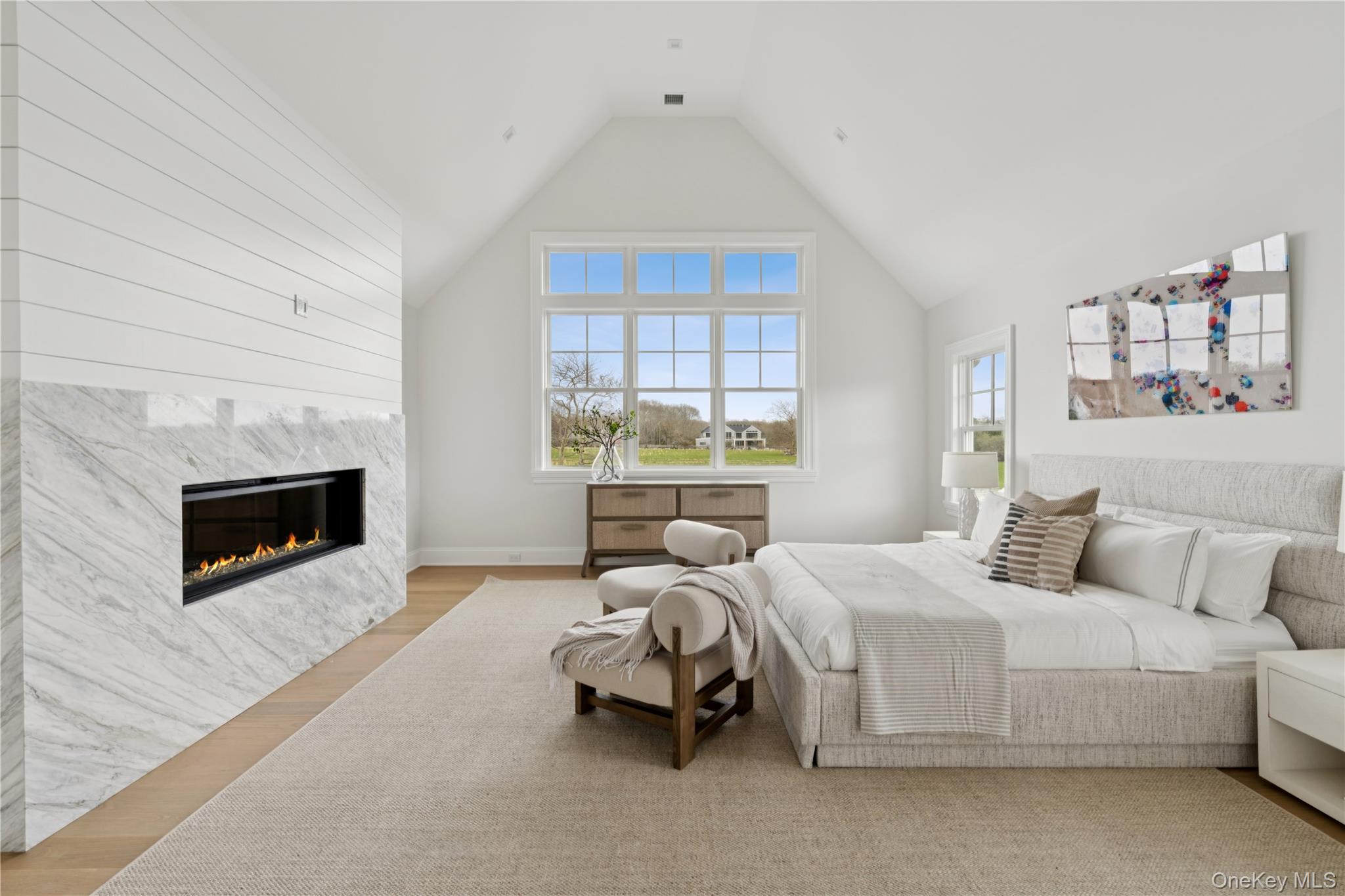 450 7 Ponds Towd Road Water Mill, NY 11976 - Photo 14 of 32 a bedroom with bed and a fireplace