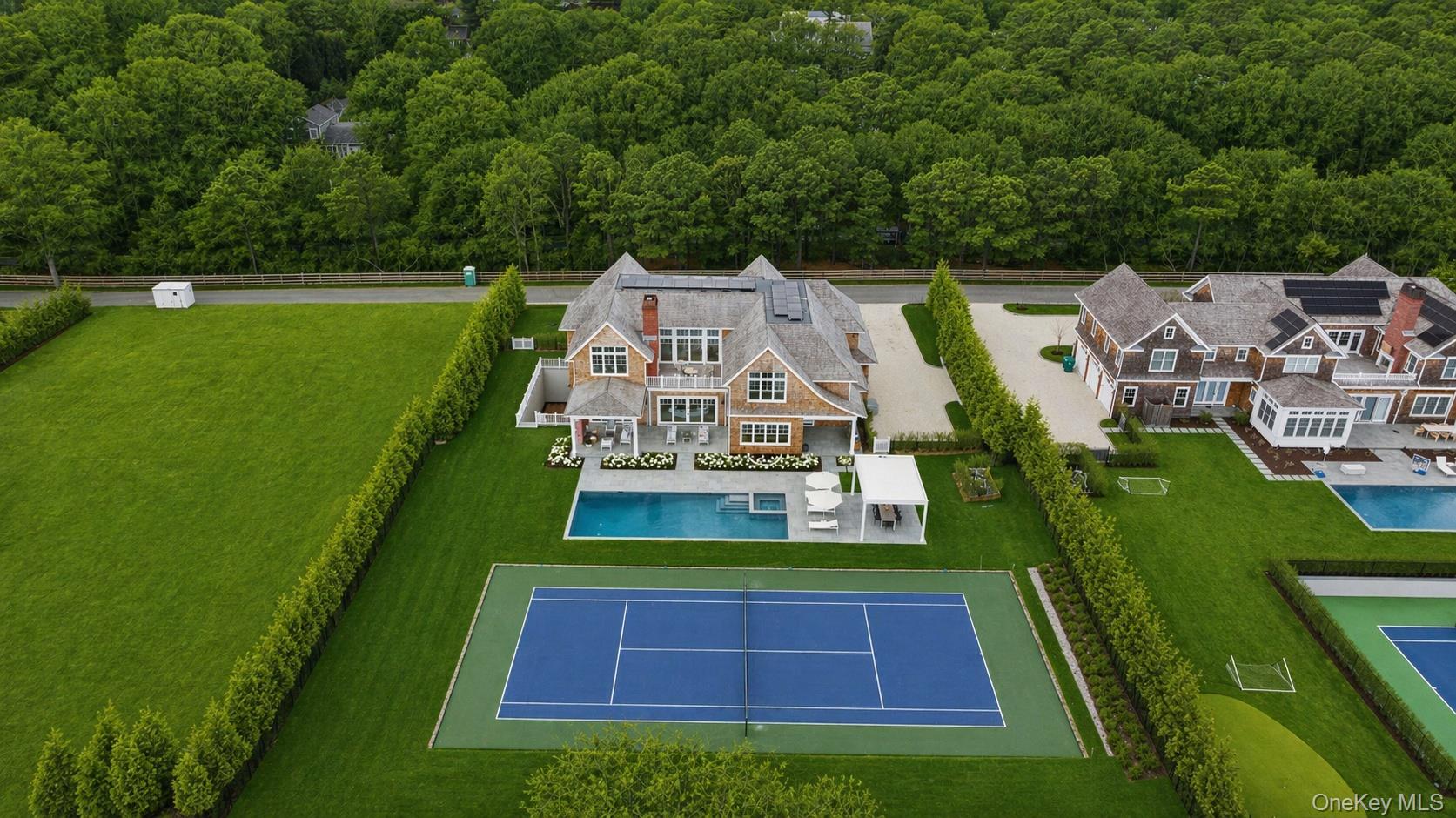 450 7 Ponds Towd Road Water Mill, NY 11976 - Photo 2 of 32 an aerial view of a house with a big yard