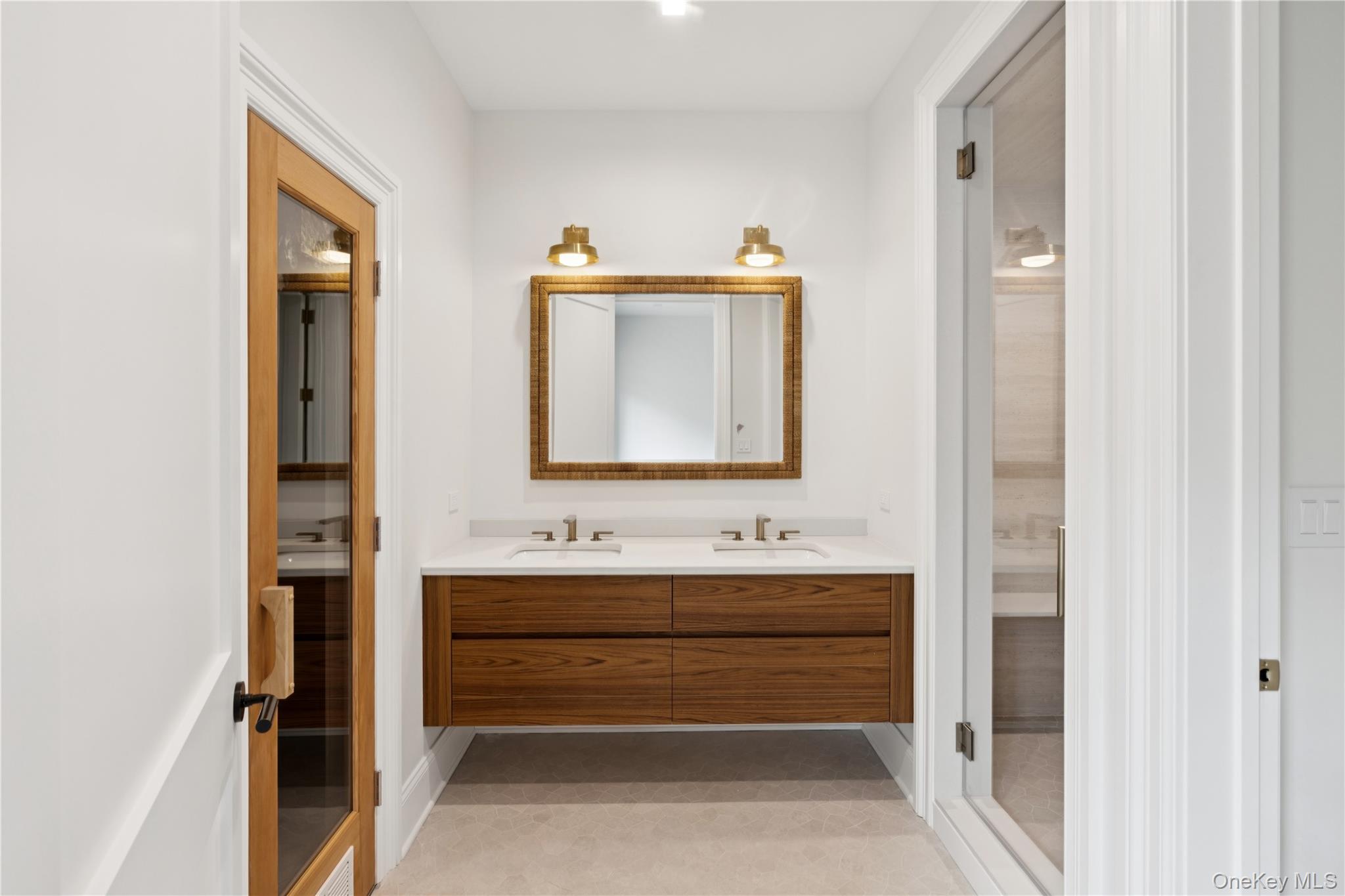 450 7 Ponds Towd Road Water Mill, NY 11976 - Photo 22 of 32 a bathroom with a sink and a mirror