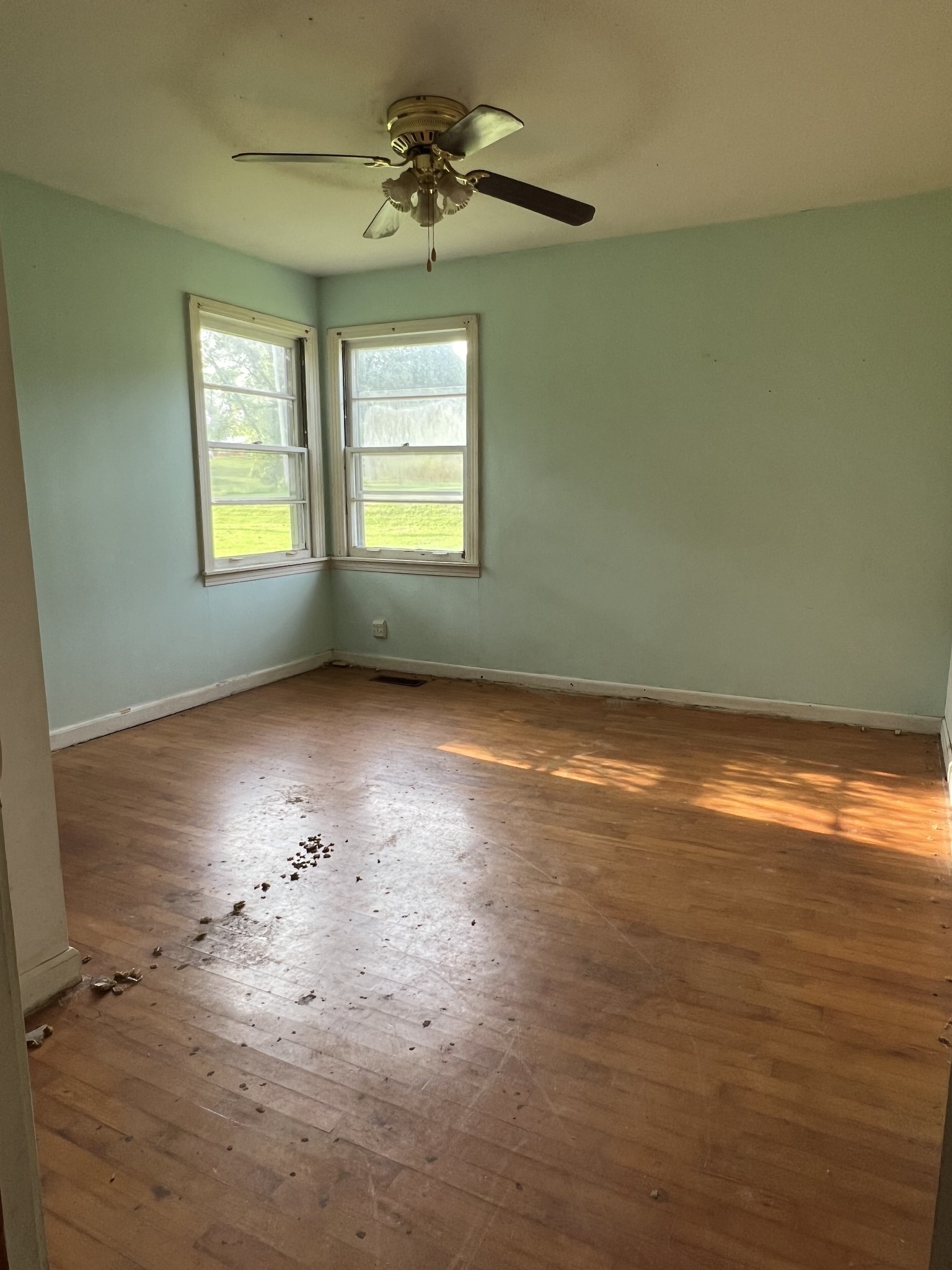 250 Chipman Road Bethpage, TN 37022 - Photo 25 of 32 an empty room with wooden floor chandelier and windows