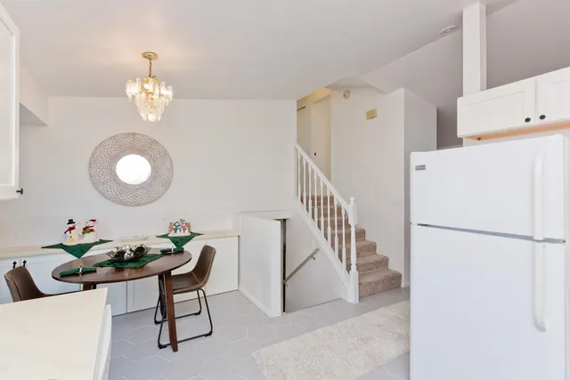 a view of kitchen with furniture and wooden floor