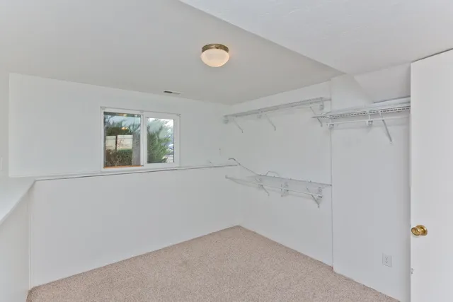 a bathroom with a sink mirror vanity and toilet