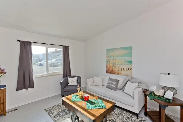 a living room with furniture and a window
