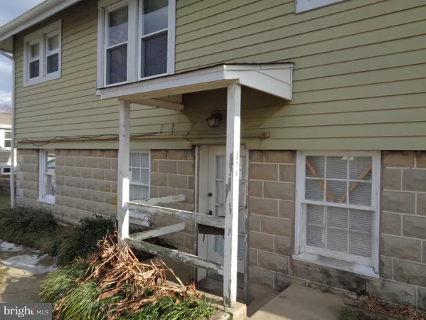 a front view of a house with a glass door