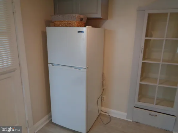 a white refrigerator freezer and a dishwasher