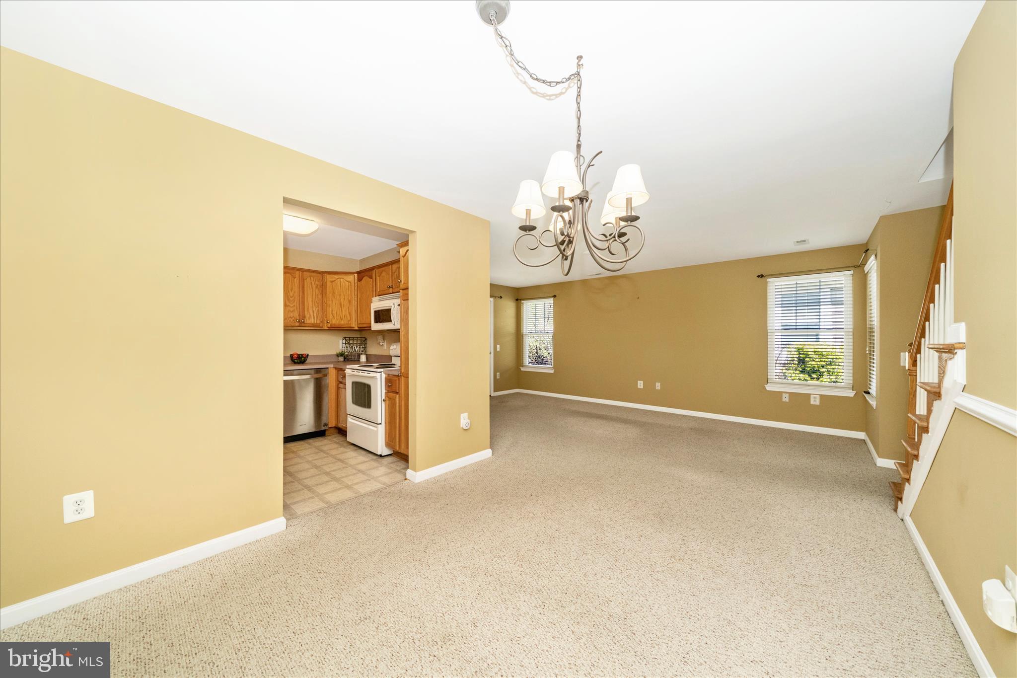 908 Roller Coaster Court Mount Airy, MD 21771 - Photo 13 of 69 a view of a livingroom with a chandelier