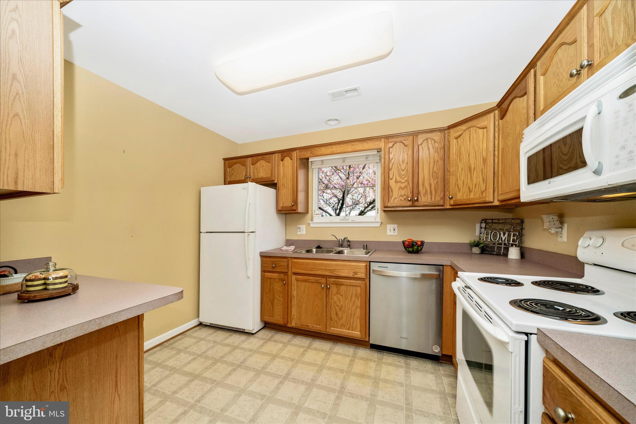 908 Roller Coaster Court Mount Airy, MD 21771 - Photo 15 of 69 a kitchen with a stove top oven sink and cabinets