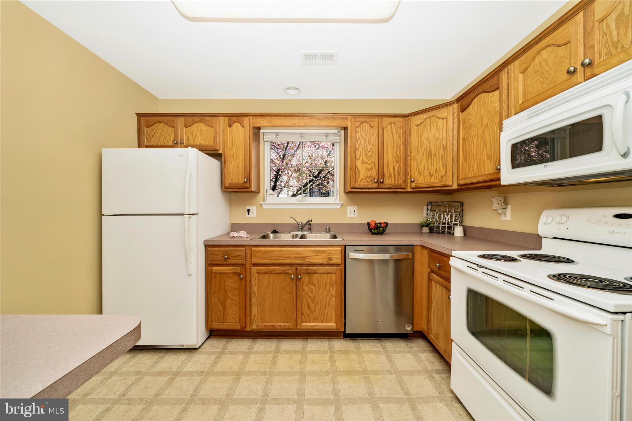 908 Roller Coaster Court Mount Airy, MD 21771 - Photo 20 of 69 a kitchen with a stove top oven sink and a refrigerator