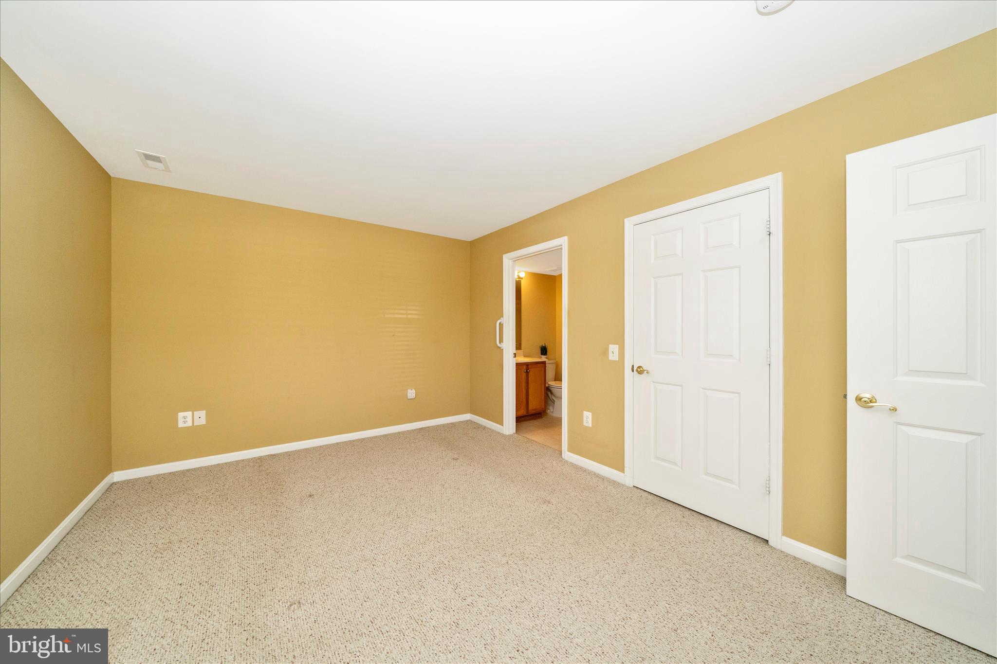 908 Roller Coaster Court Mount Airy, MD 21771 - Photo 22 of 69 a view of an empty room with wooden floor
