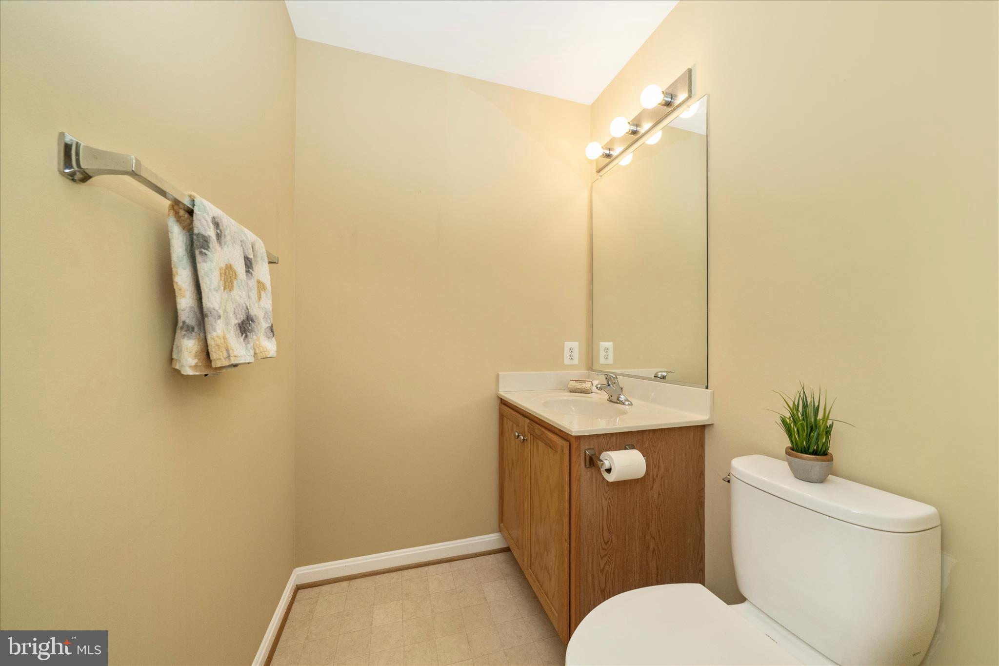 908 Roller Coaster Court Mount Airy, MD 21771 - Photo 32 of 69 a bathroom with a toilet sink and mirror