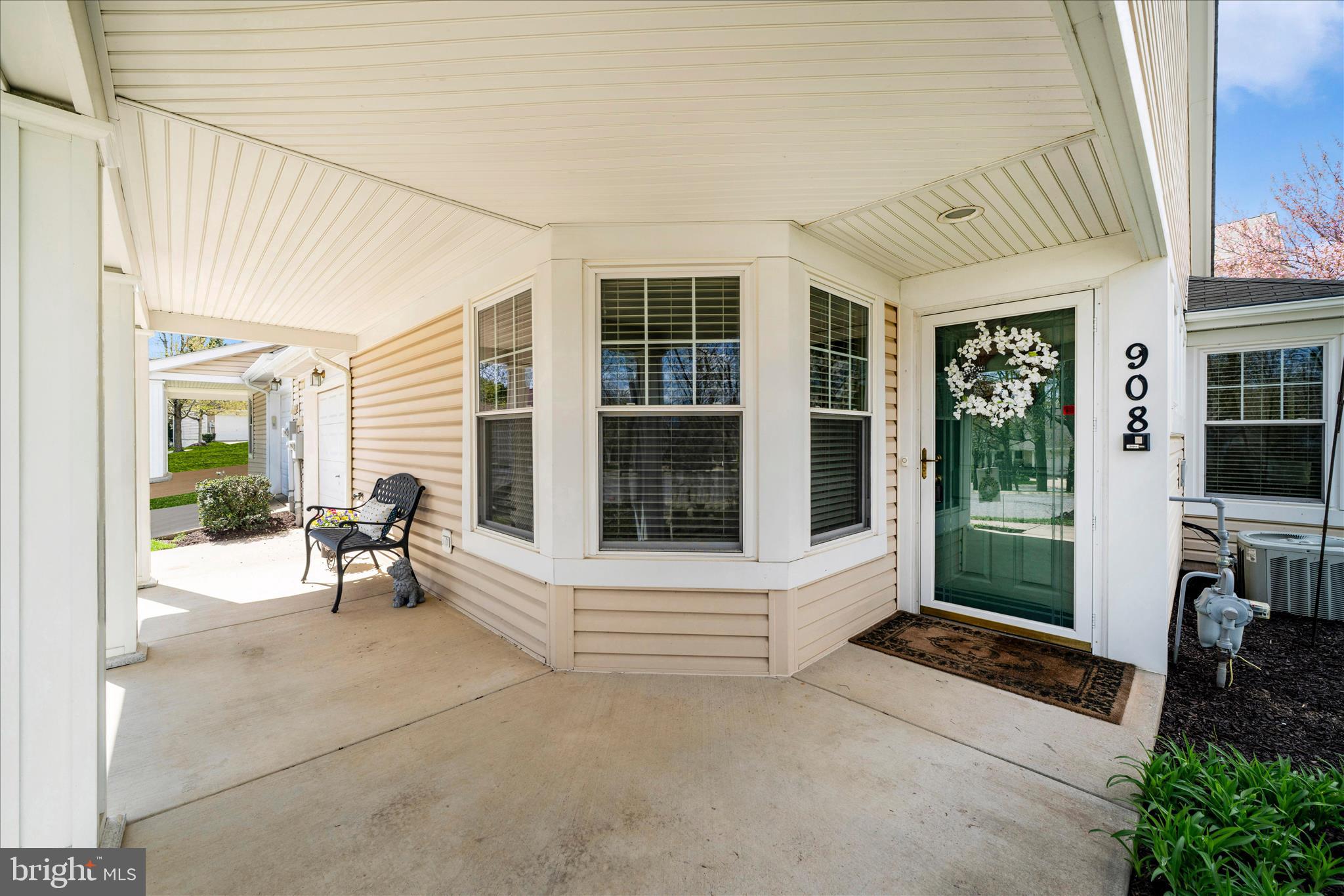 908 Roller Coaster Court Mount Airy, MD 21771 - Photo 4 of 69 a view of a porch with chairs and floor to ceiling window