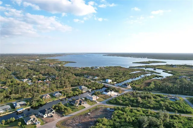 an aerial view of residential building and ocean