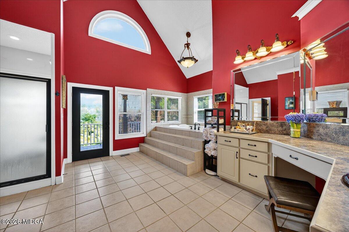 518 River Overlook Forsyth, GA 31029 - Photo 57 of 96 a kitchen with stainless steel appliances granite countertop a stove a sink and a microwave