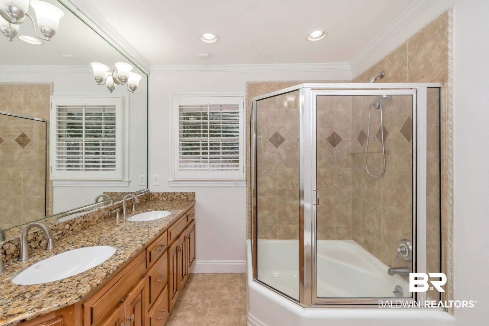 231 Rochester Road Mobile, AL 36608 - Photo 34 of 51 Bathroom featuring double vanity, ornamental molding, combined bath / shower with glass door, light tile patterned floors, and recessed lighting