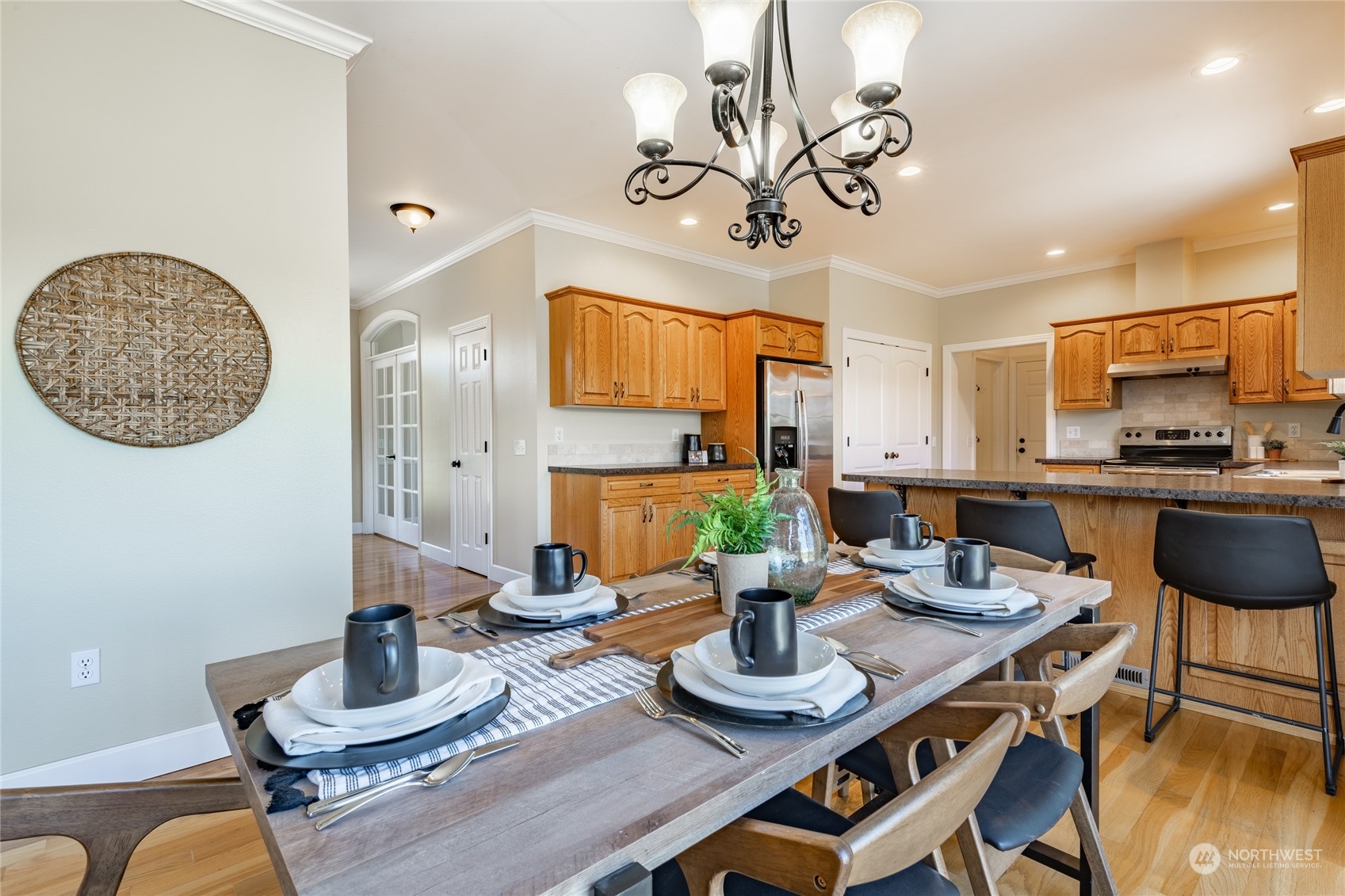 6708 Woodlyn Road Ferndale, WA 98248 - Photo 14 of 40 a kitchen with a dining table and chairs
