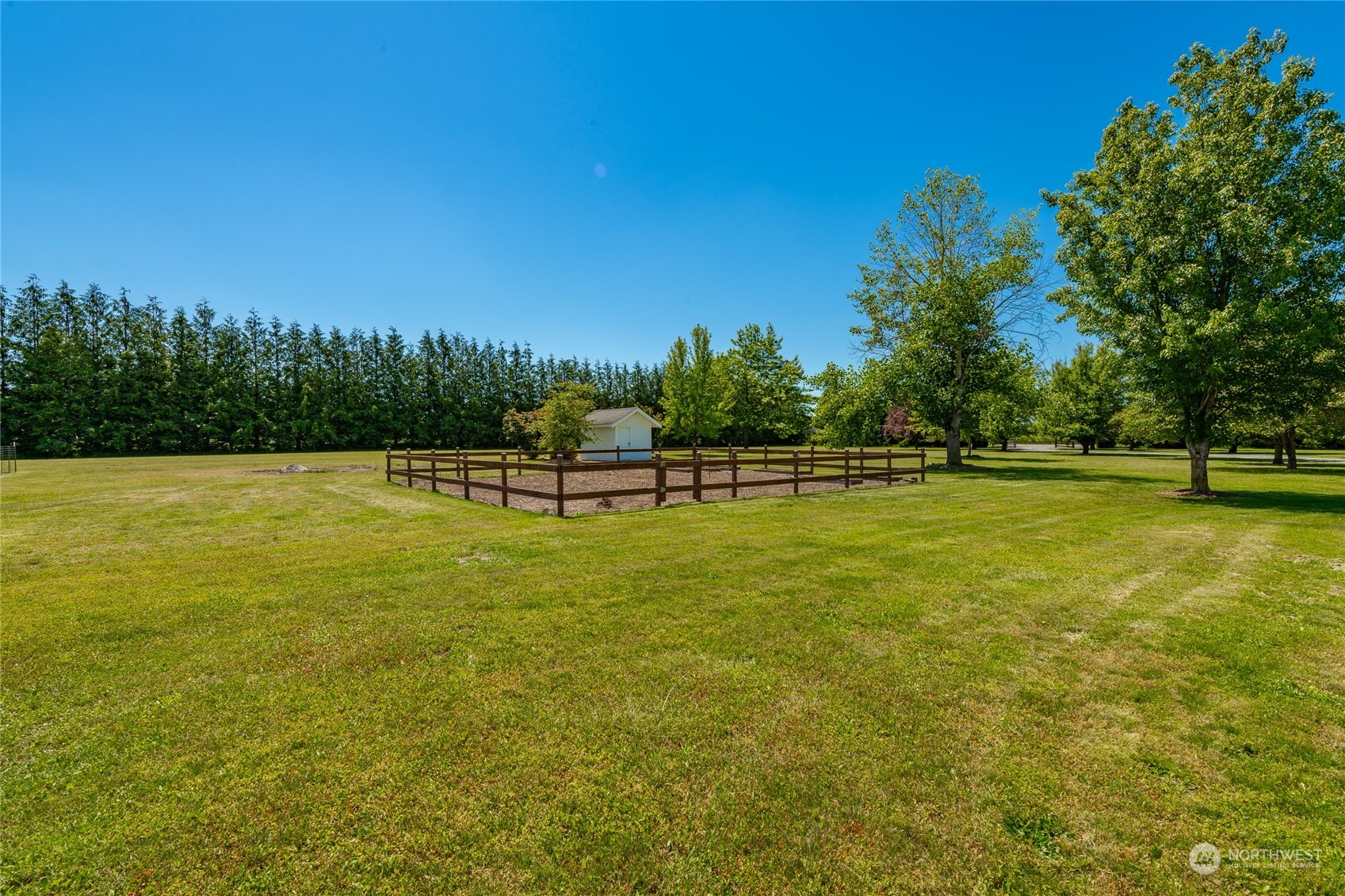 6708 Woodlyn Road Ferndale, WA 98248 - Photo 32 of 40 a view of a swimming pool with a garden