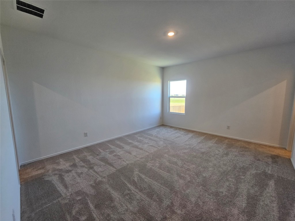 856 Rancho Del Cielo Loop Jarrell, TX 76537 - Photo 11 of 35 a view of empty room with window