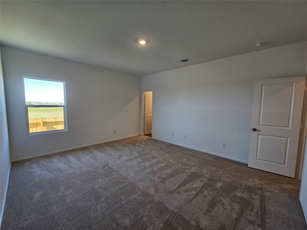 856 Rancho Del Cielo Loop Jarrell, TX 76537 - Photo 12 of 35 a view of an empty room